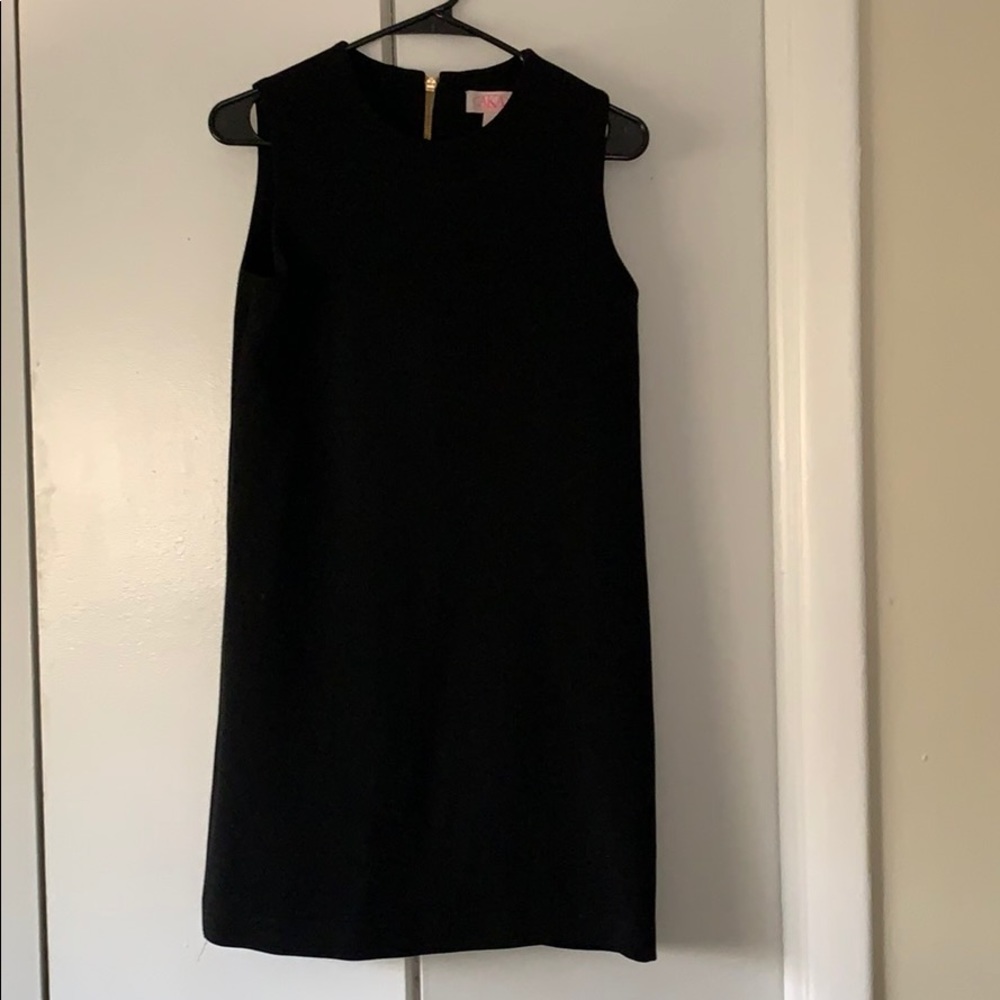 “It’s all about the back zipper”black dress